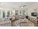Cozy living room with hardwood floors, ceiling fan, and comfortable seating arrangement at 7101 Bowen Corner Ave, Hanahan, SC 29410