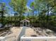 Spacious backyard with a charming gazebo and sandy beach area, perfect for outdoor entertaining at 78 Hannibal Trl, Ridgeville, SC 29472
