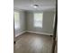 Bright bedroom with wood look floors, and fresh neutral paint at 78 Hannibal Trl, Ridgeville, SC 29472