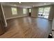 Spacious living room with fresh neutral paint, wood look floors, and access to the deck at 78 Hannibal Trl, Ridgeville, SC 29472