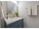 Bathroom vanity features a blue cabinet, gold hardware, and a marble countertop at 7993 Malden Ave, North Charleston, SC 29420