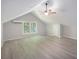 Spacious bedroom features light wood flooring, ceiling fan, and bright windows at 7993 Malden Ave, North Charleston, SC 29420