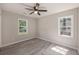Empty bedroom with two windows and a ceiling fan at 7993 Malden Ave, North Charleston, SC 29420