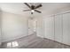 Empty bedroom with three white doors and light gray flooring at 7993 Malden Ave, North Charleston, SC 29420