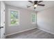 Bright bedroom with two windows and light gray flooring at 7993 Malden Ave, North Charleston, SC 29420