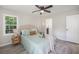 Bright bedroom with ceiling fan, a decorative rug and two windows for natural light at 7993 Malden Ave, North Charleston, SC 29420