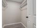 Walk-in closet with white shelves and light gray flooring at 7993 Malden Ave, North Charleston, SC 29420
