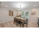 Dining room featuring a wooden table, modern lighting, and french doors to the backyard at 7993 Malden Ave, North Charleston, SC 29420