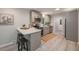Modern kitchen featuring stainless steel appliances, gray cabinets and a peninsula with seating at 7993 Malden Ave, North Charleston, SC 29420