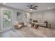 Cozy living room with neutral tones, a ceiling fan, and lots of natural light at 7993 Malden Ave, North Charleston, SC 29420