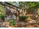 Inviting backyard with a patio, lush plantings and mature trees creating a private retreat at 810 Creekside Dr, Mount Pleasant, SC 29464