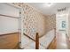 A hallway featuring floral wallpaper and hardwood floors leads to other rooms in the house at 810 Creekside Dr, Mount Pleasant, SC 29464