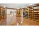 Open-concept living room featuring hardwood floors, and an adjoining room with built-in bookshelves at 810 Creekside Dr, Mount Pleasant, SC 29464