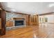 Cozy living room featuring hardwood floors, a brick fireplace, and built-in bookshelves for displaying your treasures at 810 Creekside Dr, Mount Pleasant, SC 29464