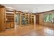 Charming living room featuring hardwood floors, built-in bookshelves, and wood paneling for a classic look at 810 Creekside Dr, Mount Pleasant, SC 29464