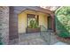 Charming covered porch with brick flooring and stylish lighting, a welcoming entry at 810 Creekside Dr, Mount Pleasant, SC 29464