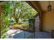 Inviting covered porch with brick flooring and a view of the beautifully landscaped front yard at 810 Creekside Dr, Mount Pleasant, SC 29464