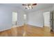 Spacious bedroom features hardwood floors, ceiling fan and ensuite bathroom at 8524 Brookforest Dr, Charleston, SC 29406