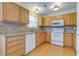 Bright kitchen with wooden cabinetry, granite countertops, modern appliances, and tile backsplash at 8524 Brookforest Dr, Charleston, SC 29406
