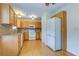 Well-lit kitchen with wood floors, wooden cabinets, modern appliances, and granite countertops at 8524 Brookforest Dr, Charleston, SC 29406