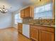 Kitchen featuring oak cabinets, stainless steel appliances, granite counters and backsplash at 8524 Brookforest Dr, Charleston, SC 29406