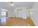 Bright living room with hardwood floors, ceiling fan, and views to kitchen and hallway at 8524 Brookforest Dr, Charleston, SC 29406