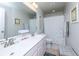 Bright bathroom with double vanity, large mirror, and shower with curtain at 9767 Black Willow Ln, Ladson, SC 29456