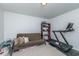 Spare room with carpet, futon, storage, and a home gym treadmill at 9767 Black Willow Ln, Ladson, SC 29456