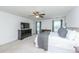 This bright and airy bedroom has neutral colors, two windows, and a ceiling fan at 9767 Black Willow Ln, Ladson, SC 29456
