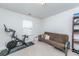 Spare room featuring a Peloton stationary bike and a futon on carpeted flooring at 9767 Black Willow Ln, Ladson, SC 29456