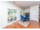 Bright breakfast area with a view of the patio through sliding glass doors and blue accent chairs at 9767 Black Willow Ln, Ladson, SC 29456