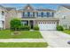 Charming two-story home with a brick facade, manicured lawn, and a two-car garage, perfect for suburban living at 9767 Black Willow Ln, Ladson, SC 29456