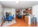 Open kitchen with stainless steel appliances, granite countertops, a central island, and a breakfast nook at 9767 Black Willow Ln, Ladson, SC 29456
