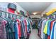 Spacious walk-in closet with ample hanging space and shelving for organized storage at 9767 Black Willow Ln, Ladson, SC 29456
