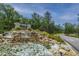 Inviting community entrance with serene waterfall feature and beautifully landscaped surroundings at 9767 Black Willow Ln, Ladson, SC 29456