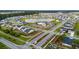 Aerial view of a neighborhood with a community pool, playground, fire pit, lake and Gathering homes at 102 Bolsena Ct, Summerville, SC 29486