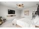 Comfortable bedroom featuring a TV, stylish decorations, and easy access to the bathroom at 102 Bolsena Ct, Summerville, SC 29486