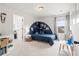Charming bedroom with unique wall decor, cozy bed, playful accents, and abundant natural light at 102 Bolsena Ct, Summerville, SC 29486