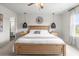 Bright bedroom featuring a cozy bed, stylish lighting fixtures, and ample natural light at 102 Bolsena Ct, Summerville, SC 29486