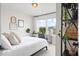 Bright bedroom featuring a queen bed, large windows offering great natural light, and stylish decor at 102 Bolsena Ct, Summerville, SC 29486