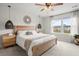 Cozy bedroom with natural wood furniture, ample natural light, and decorative hanging lamps at 102 Bolsena Ct, Summerville, SC 29486