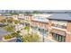 Exterior view of several businesses in a commercial area, featuring modern brick buildings and covered walkways at 102 Bolsena Ct, Summerville, SC 29486