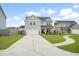 Charming two-story home with a long driveway and sidewalk in a Gathering friendly neighborhood at 102 Bolsena Ct, Summerville, SC 29486