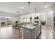 Spacious kitchen island with sink overlooks the dining area and living room at 102 Bolsena Ct, Summerville, SC 29486