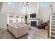 Bright living room with fireplace, large sectional sofa, high ceilings, and plenty of natural light at 102 Bolsena Ct, Summerville, SC 29486