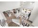 Aerial view of open concept living space with sectional couch, kitchen island, and dining area at 102 Bolsena Ct, Summerville, SC 29486