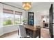Inviting home office with rustic wood desk, charming light fixture, and an abundance of natural light at 102 Bolsena Ct, Summerville, SC 29486