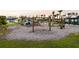 Community playground with swings, slides, spring riders, and a nautical themed jungle gym at 102 Bolsena Ct, Summerville, SC 29486