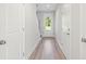 Bright foyer features wood-look flooring, neutral paint, and natural light from the front door at 102 Hawthorne Landing Dr, Goose Creek, SC 29445