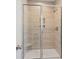 Modern shower with light tile, glass door, built-in niche, and seating at 102 Hawthorne Landing Dr, Goose Creek, SC 29445